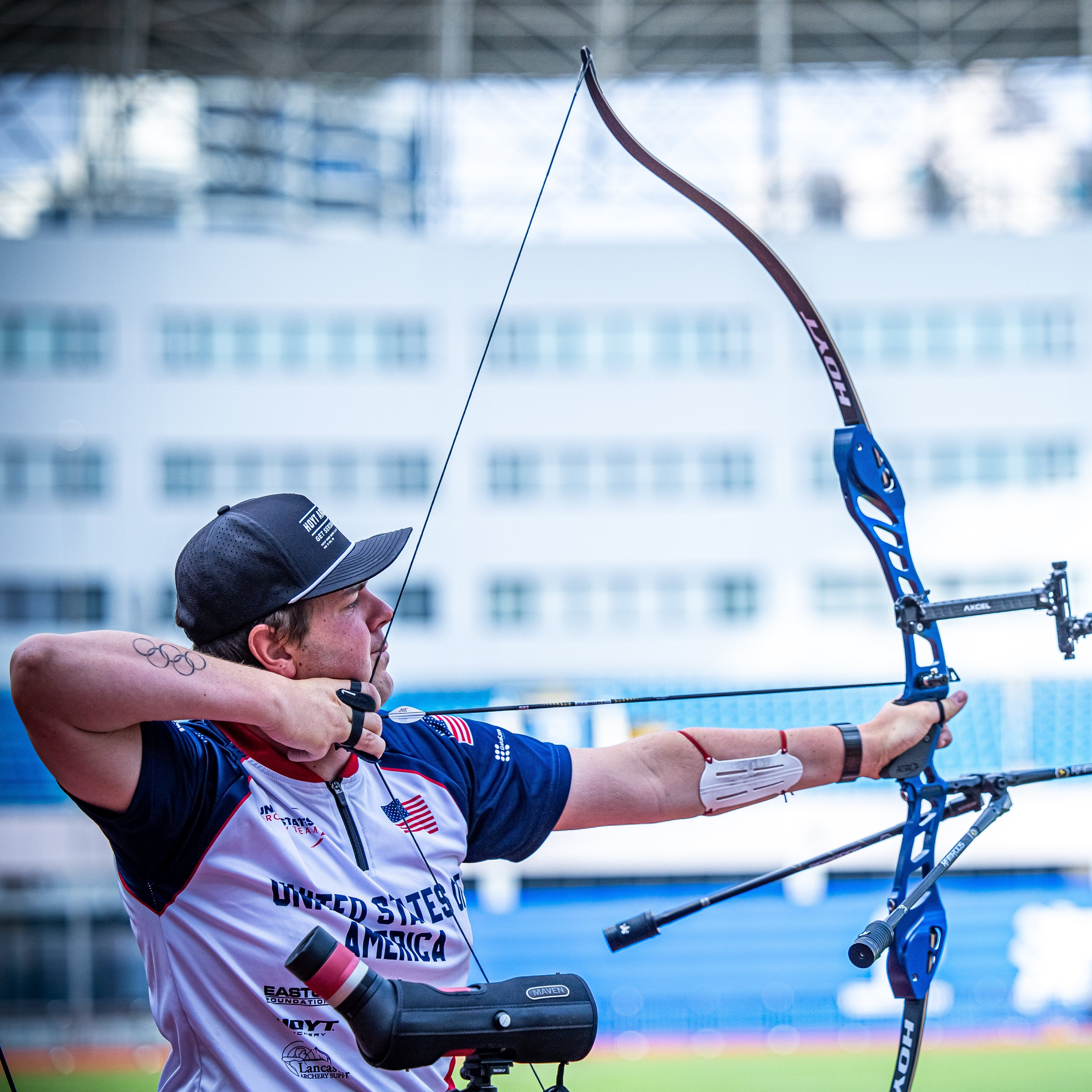 Archer in USA Jersey Shooting A bow.