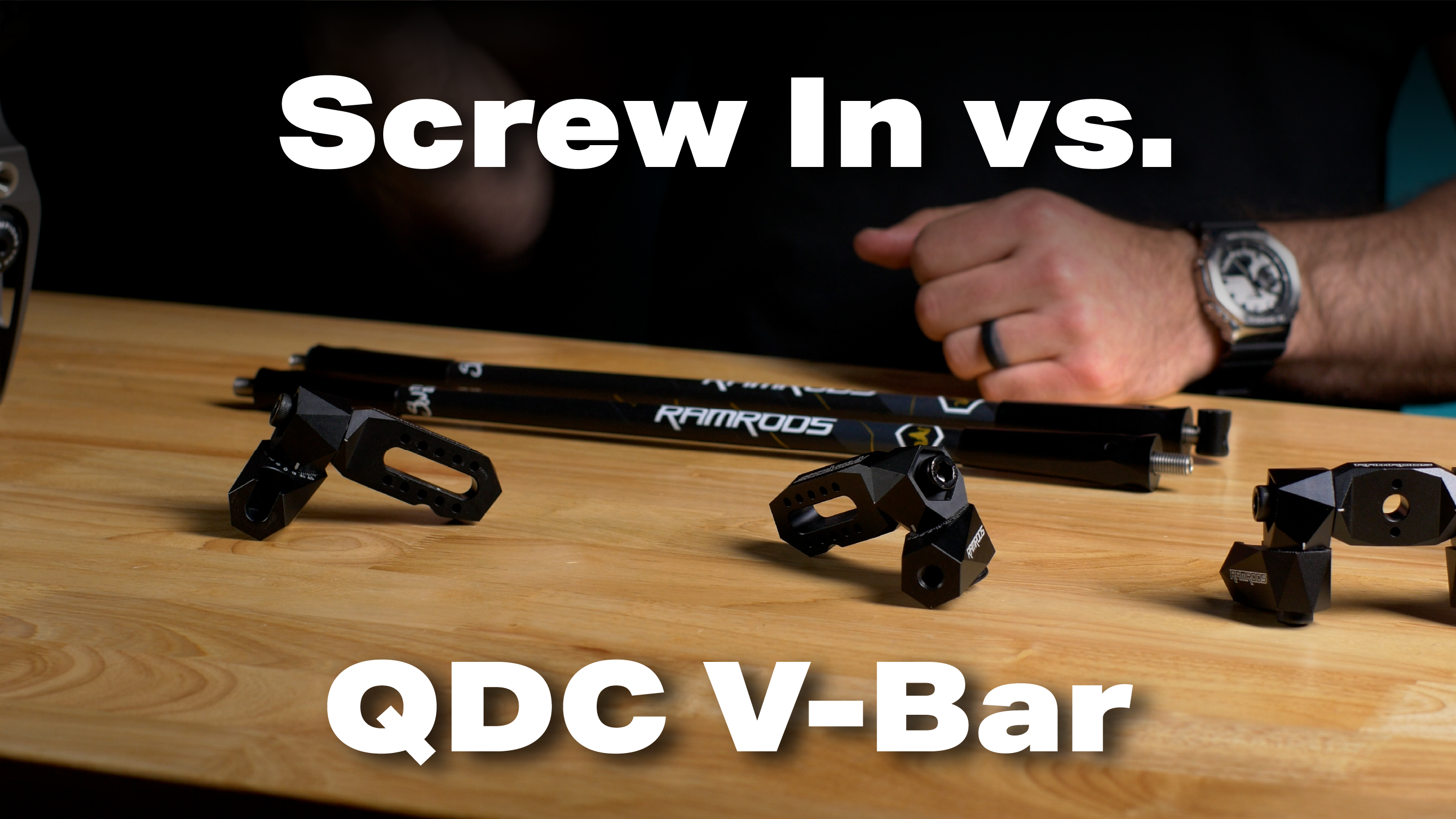 RamRods adjustable offset mount in the quick disconnect and screw in version sitting on a table. The text says "Screw in vs. QDC V-Bar."